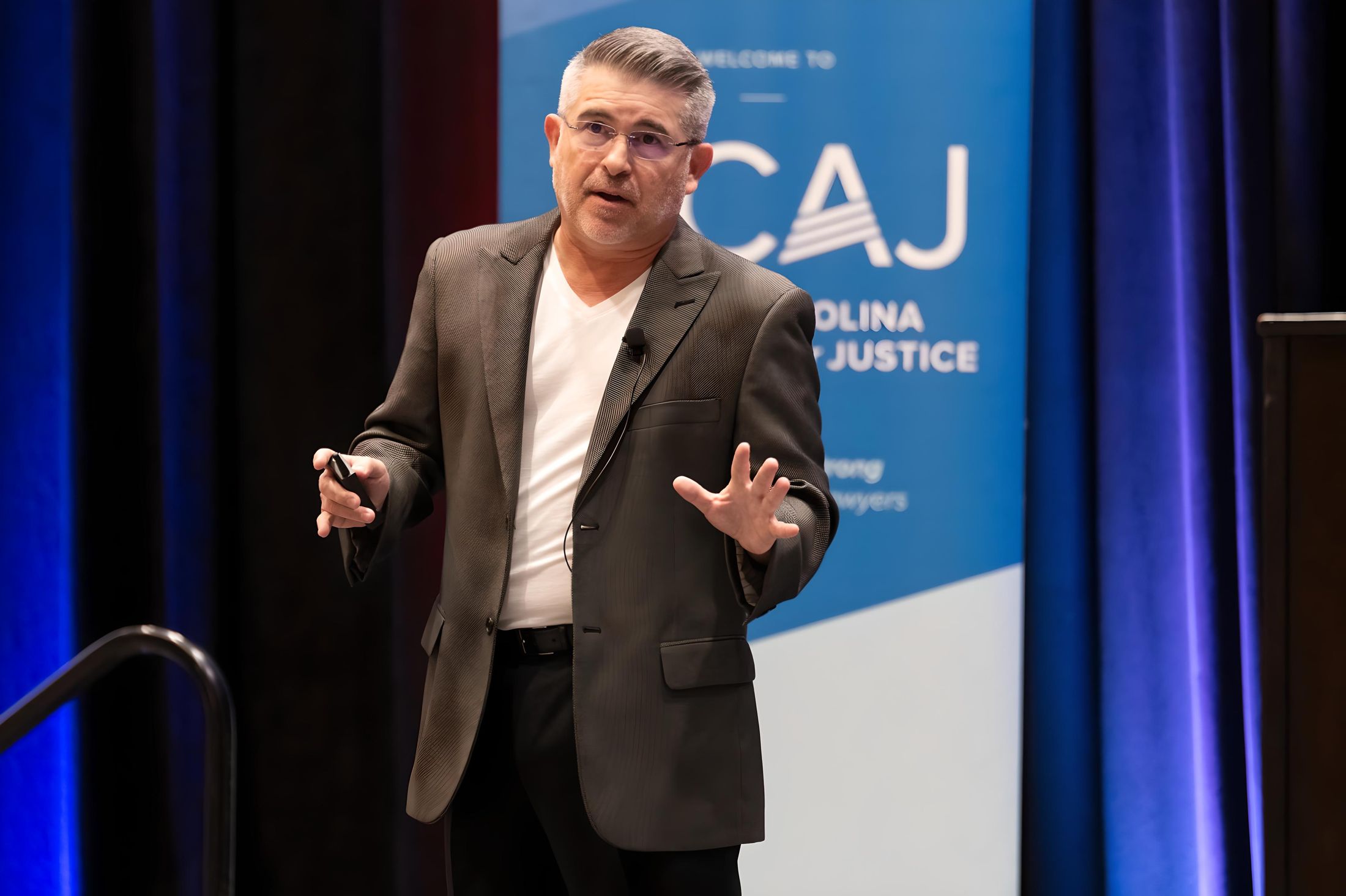 Eric Sanchez speaking on stage at the NCAJ Strategy Summit