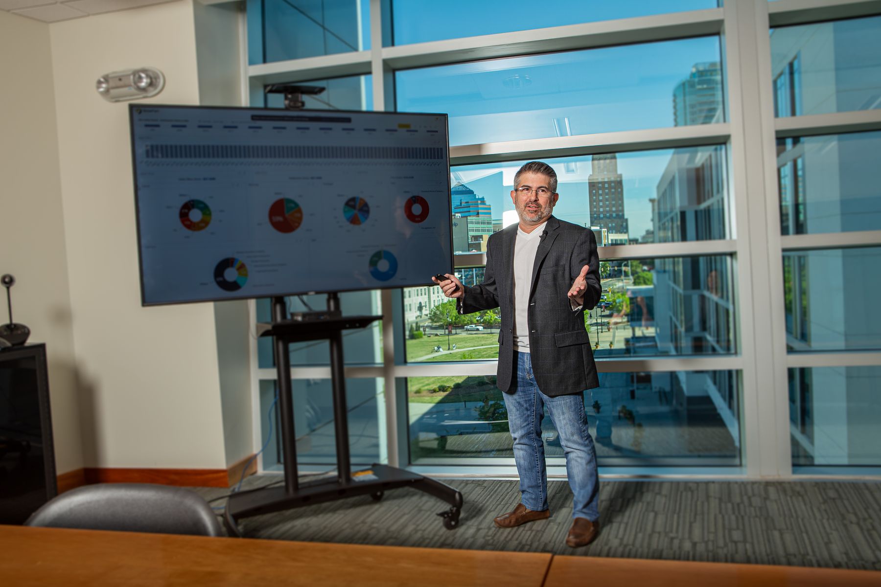 Eric Sanchez presenting a firm performance dashboard