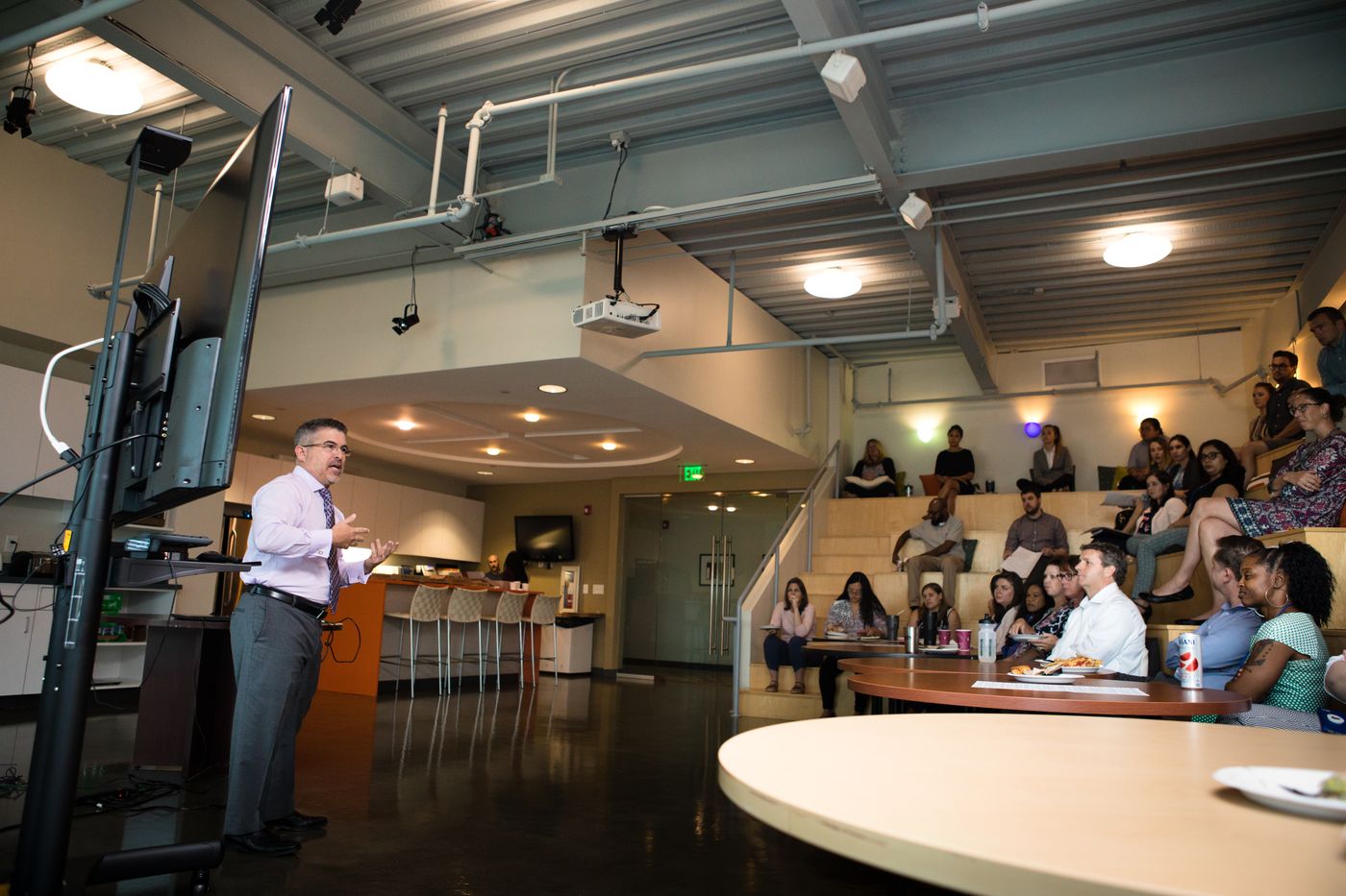 Eric Sanchez presenting to a seated audience