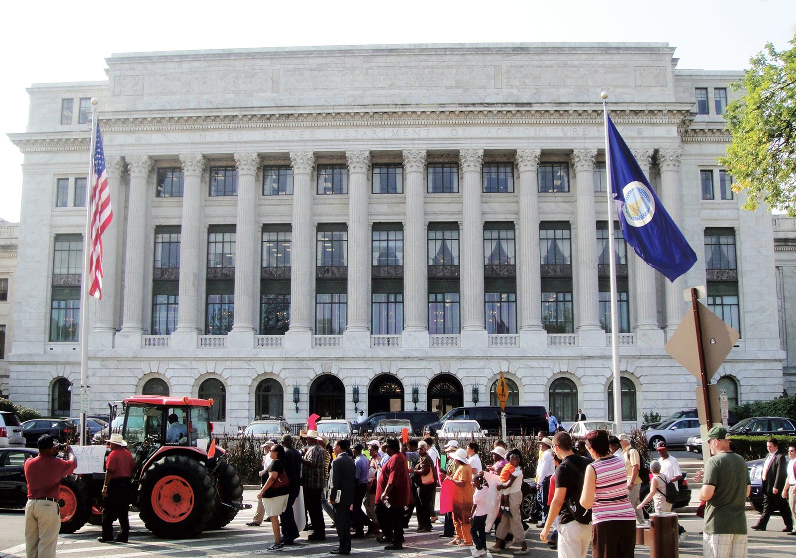 Black farmers and supporters marching outside the US Department of Agriculture